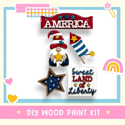 The image is a collage of various patriotic-themed items, including a red and white sign that says "AMERICA", a gnome holding a star, a wooden star, and a sign that says "Sweet Land of Liberty". The image also includes a rainbow, a heart, and a flower. The text "DIY WOOD PAINT KIT" is visible at the bottom of the image.