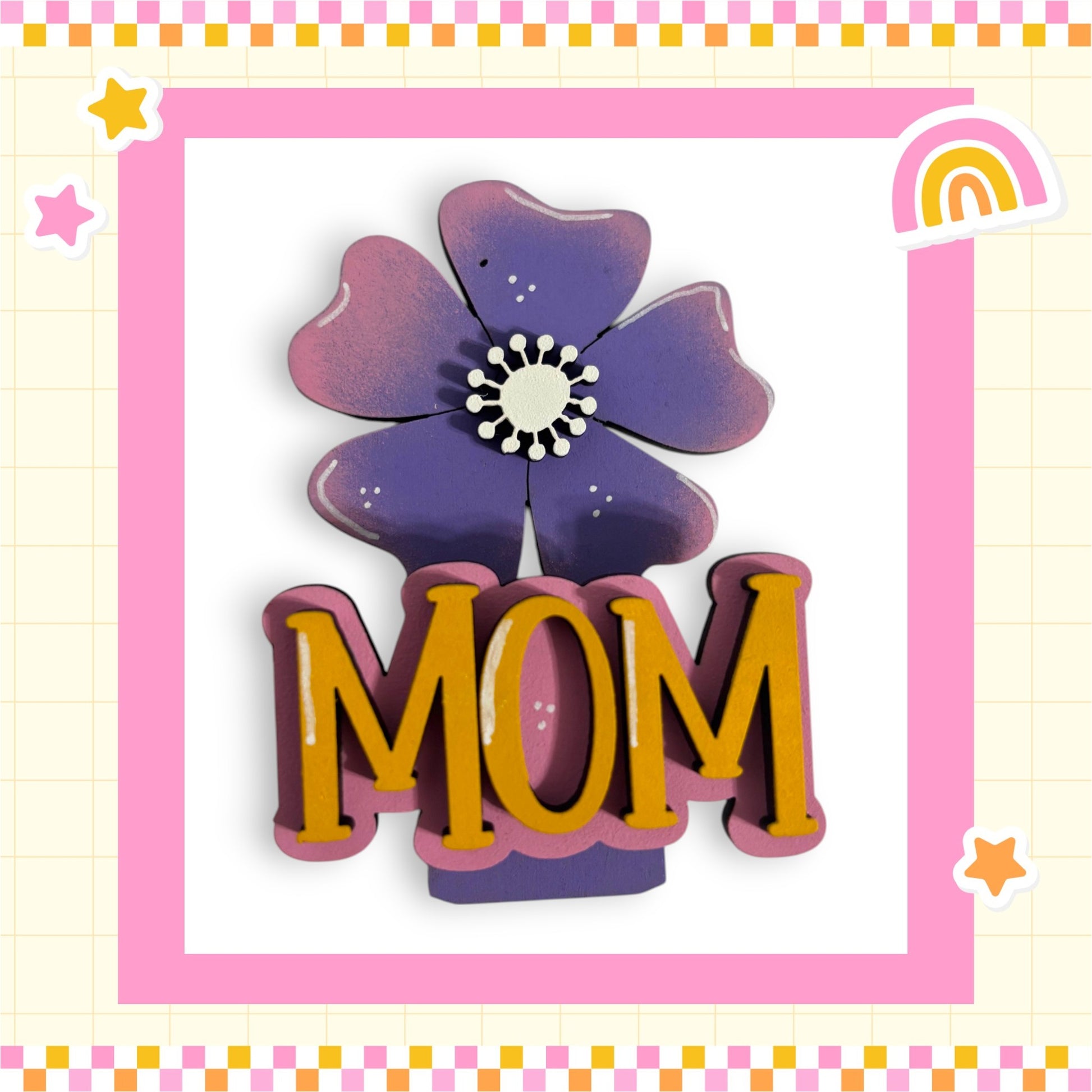 A decorative floral design with the word "MOM" prominently displayed in the center, surrounded by a pink and yellow border.