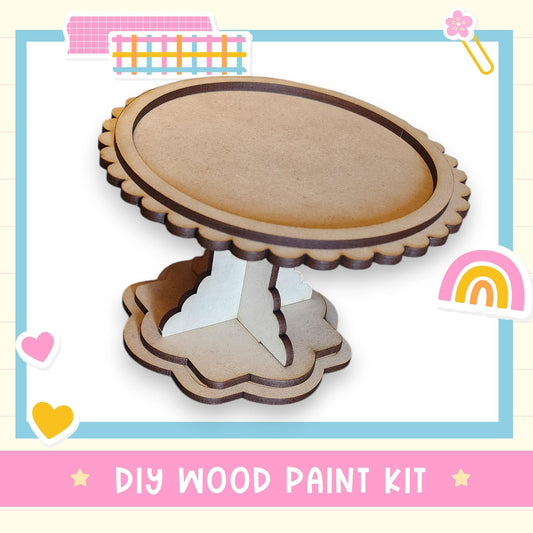 a DIY wood paint kit, with a wooden cake stand and a heart-shaped decoration.