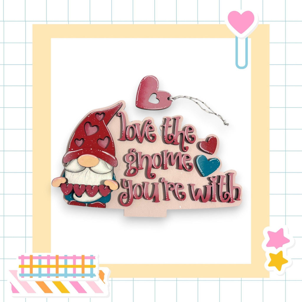 a card with a picture of a gnome holding a heart