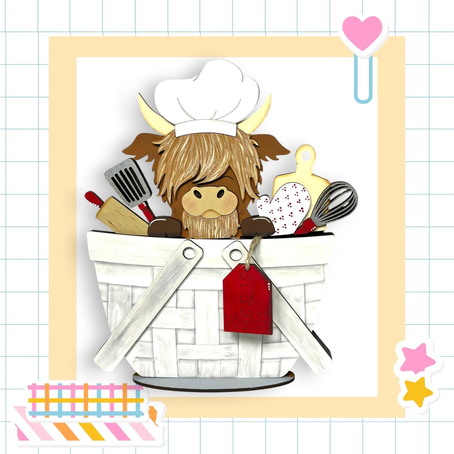 A cartoon cow wearing a chef's hat is sitting in a basket filled with various kitchen utensils, including a whisk, a spatula, and a rolling pin.