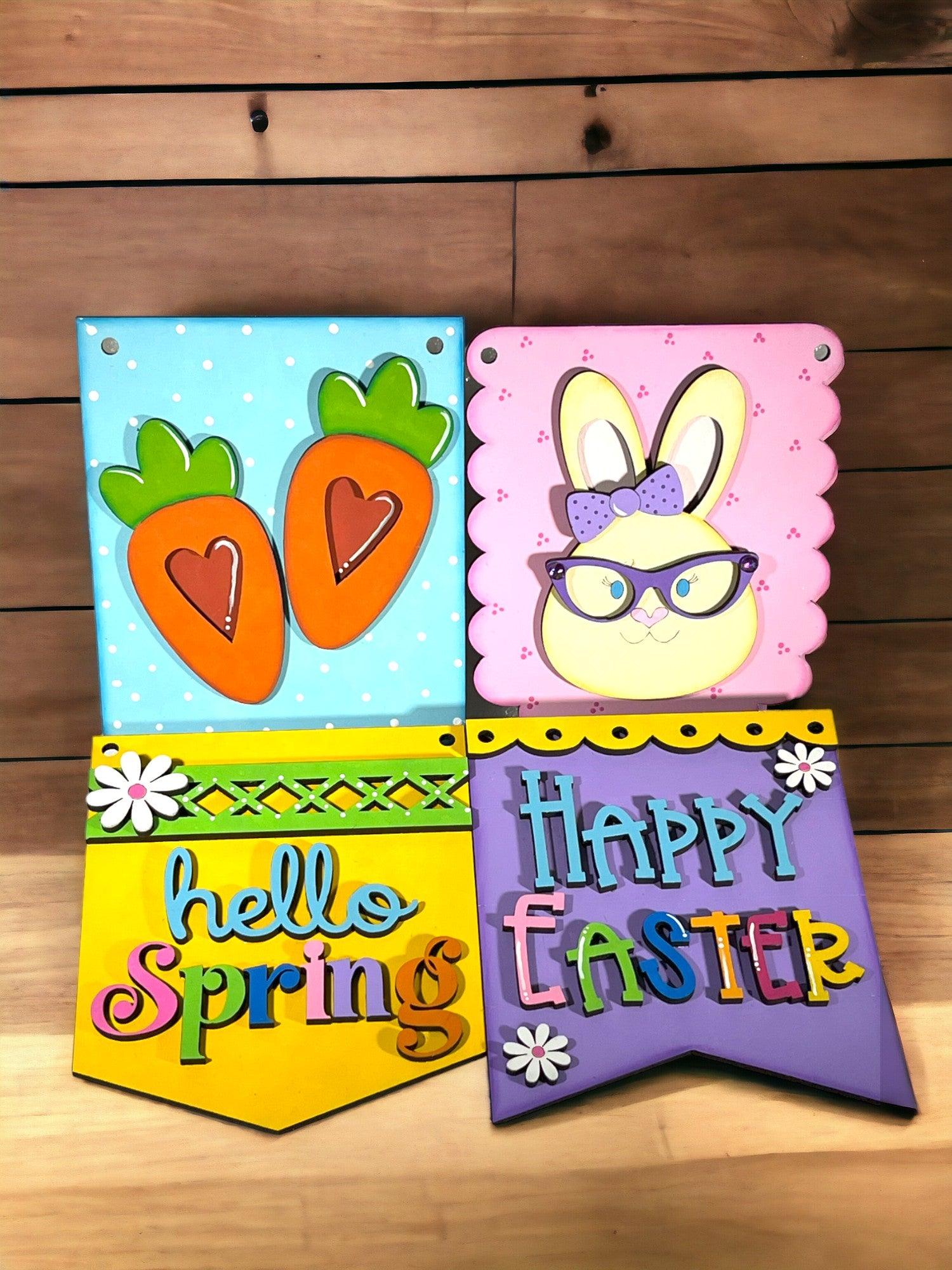 a group of three greeting cards on a wooden table