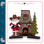 Santa Claus holding a wreath stands in front of a fireplace with a Christmas tree and a horse decoration.