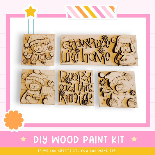 The image is a promotional poster for a DIY wood paint kit, featuring various wooden shapes and designs, including teddy bears, snowflakes, and text.