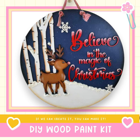 A round wooden sign with a reindeer and snowflakes, along with the text "Believe in the magic of Christmas" and a message encouraging the viewer to create their own Christmas decorations.