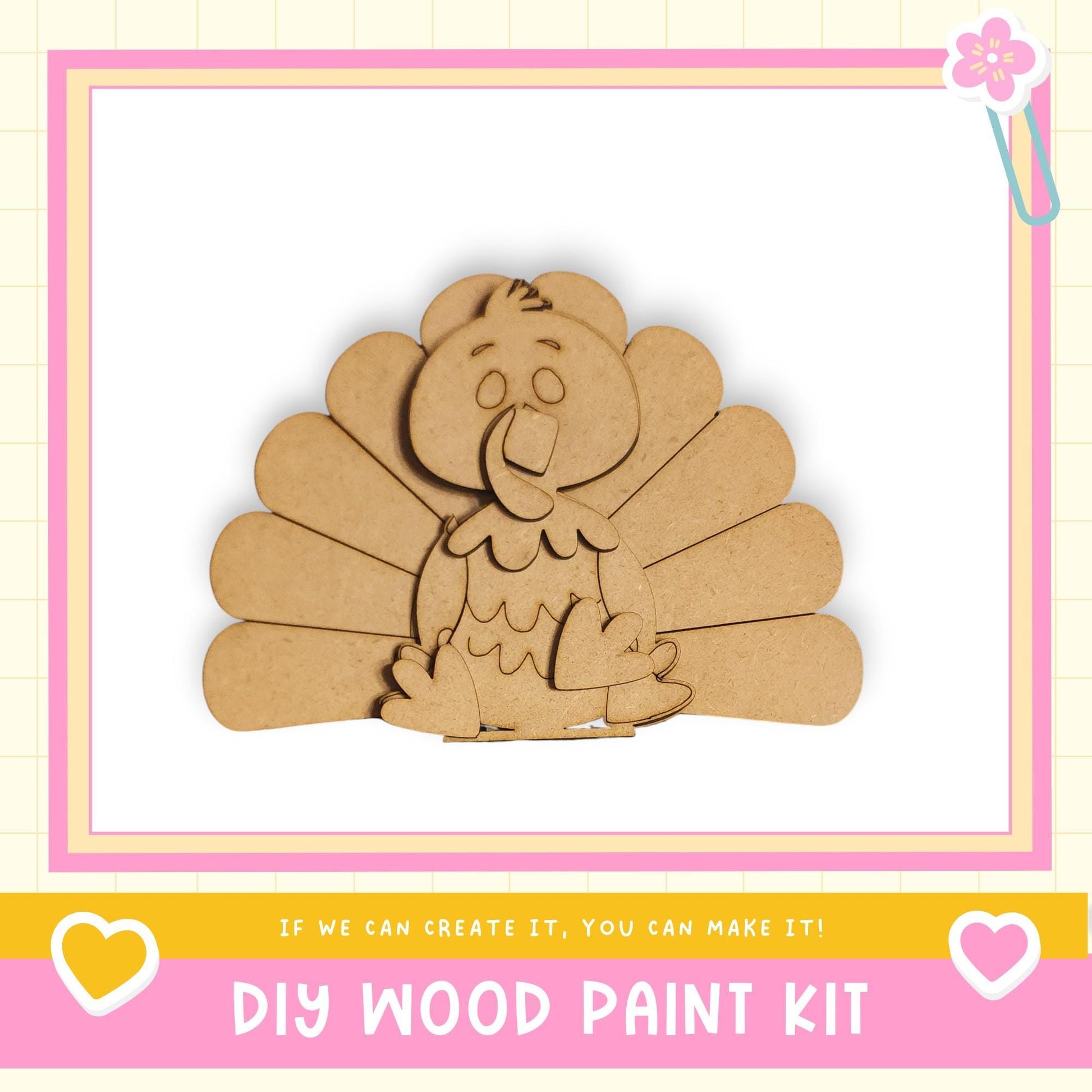 a DIY wood paint kit, with a wooden turkey figure as the main focus. The kit appears to be made of cardboard and is designed for children to create their own wooden designs.