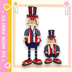two wooden figures, one larger and one smaller, dressed in patriotic attire with red, white, and blue colors.