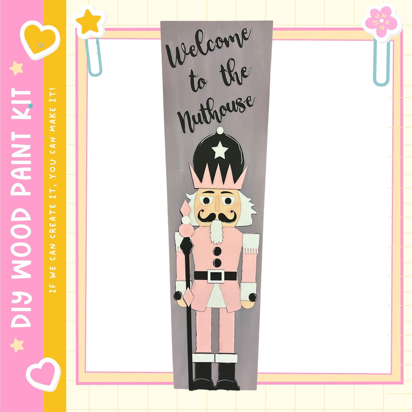 a nutcracker character with a star on its head, standing in a frame with a pink and yellow border.
