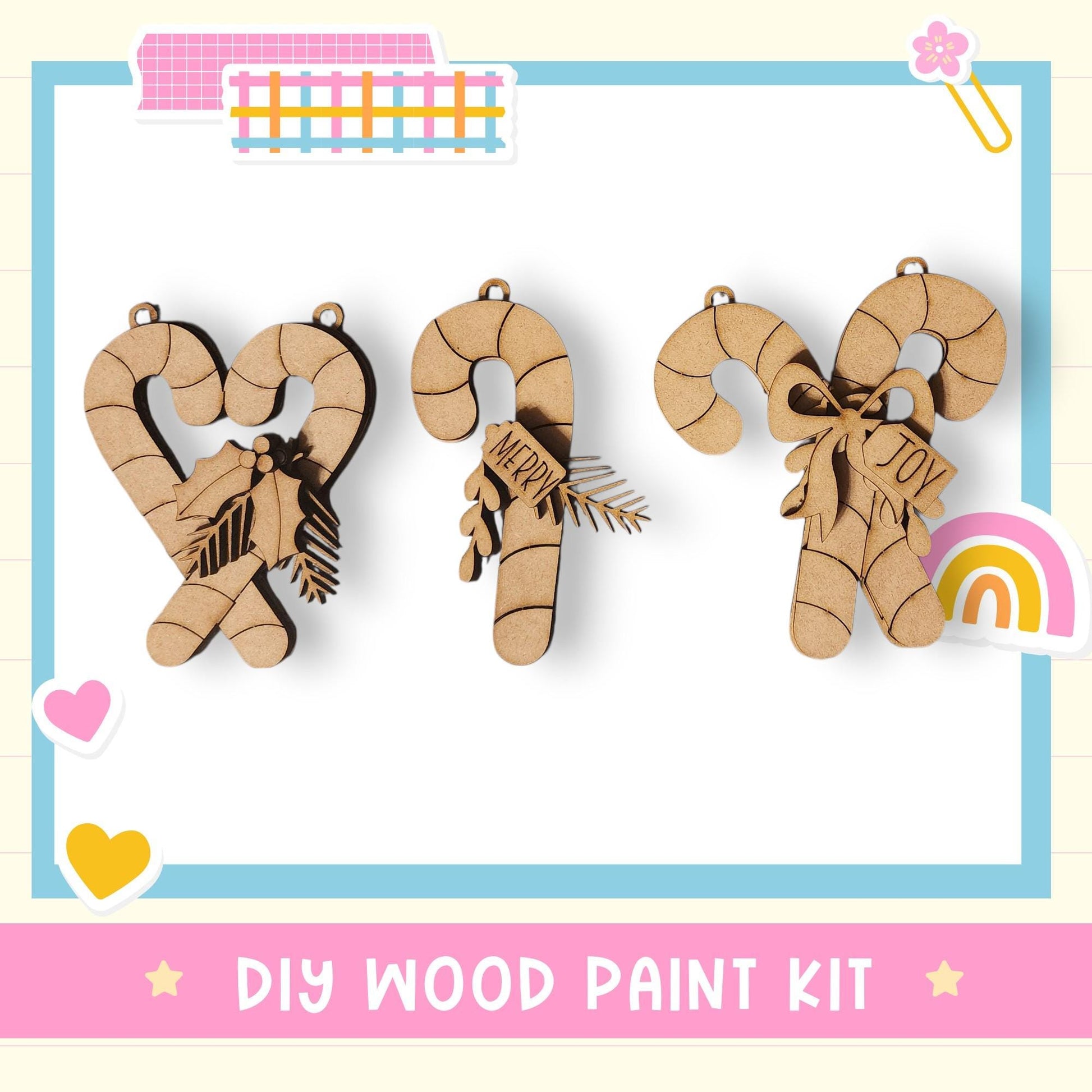 three wooden ornaments, each with a unique design and color, arranged in a row. The ornaments appear to be made of wood and are displayed against a white background. The image also includes a text overlay that reads "DIY WOOD PAINT KIT" and a small heart icon.