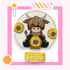 A cartoon cow holding a bunch of yellow sunflowers, with a pink and white striped border and a yellow star decoration.