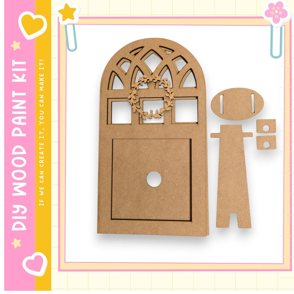 a wooden door with a wreath on top, and there are two smaller wooden pieces next to it. The image is part of a larger kit, as indicated by the text "My Wood Paint Kit" and "If we can create it, we can make it!"