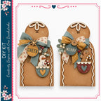 two gingerbread men with festive decorations, including bows and snowmen, against a white background.