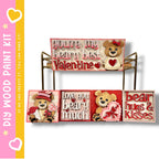 a set of four wooden paint kits designed to create Valentine's Day-themed decorations. The kits include a sign with the text "you're my beary best Valentine", a bear holding a heart, and a bear holding a heart. The kits also include a sign that says "Love you beary much" and a sign that says "bear hugs & kisses".