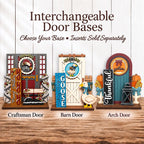 three decorative door bases, each with a unique design and color scheme, arranged on a wooden surface.