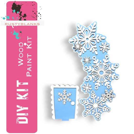 a snowflake cut out of paper next to a box