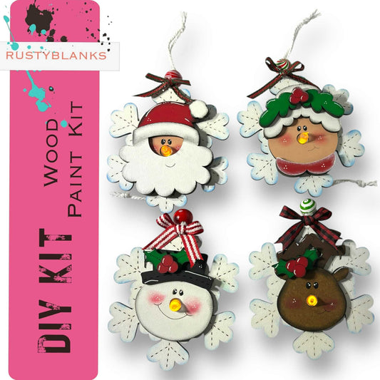 a set of four christmas ornaments hanging from strings