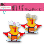 a pair of wooden pin badges with a picture of a bird