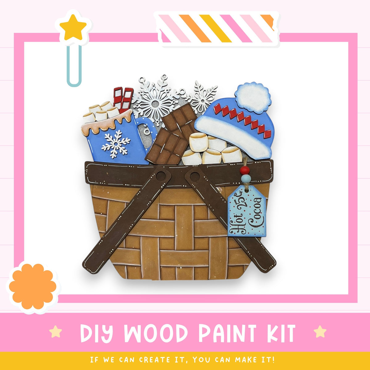 a DIY wood paint kit, which includes a wicker basket filled with various craft items such as a snowflake, marshmallows, and a blue hat. The kit appears to be made of wood and is designed for painting.