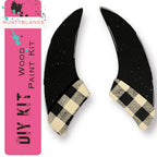 a pair of black and white checkered shoes on a white background