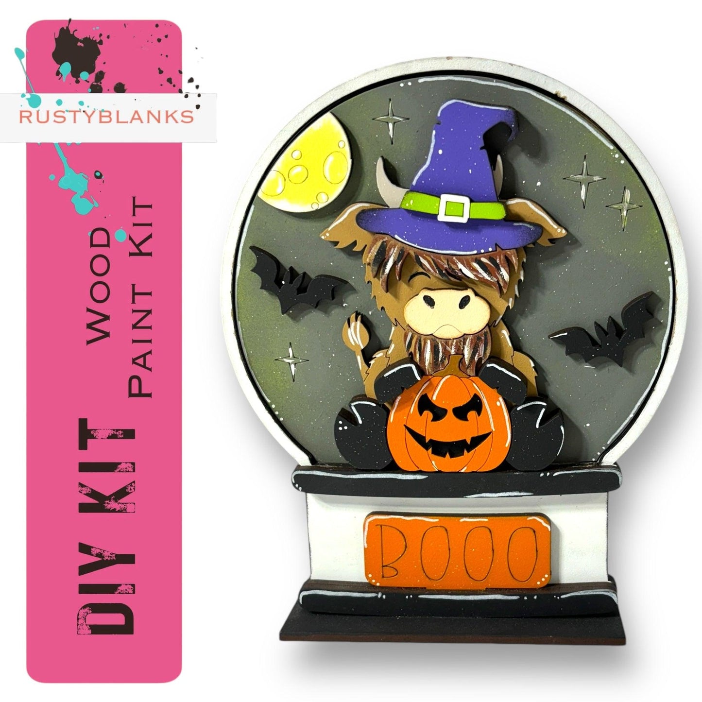 a clock with a witch sitting on top of it