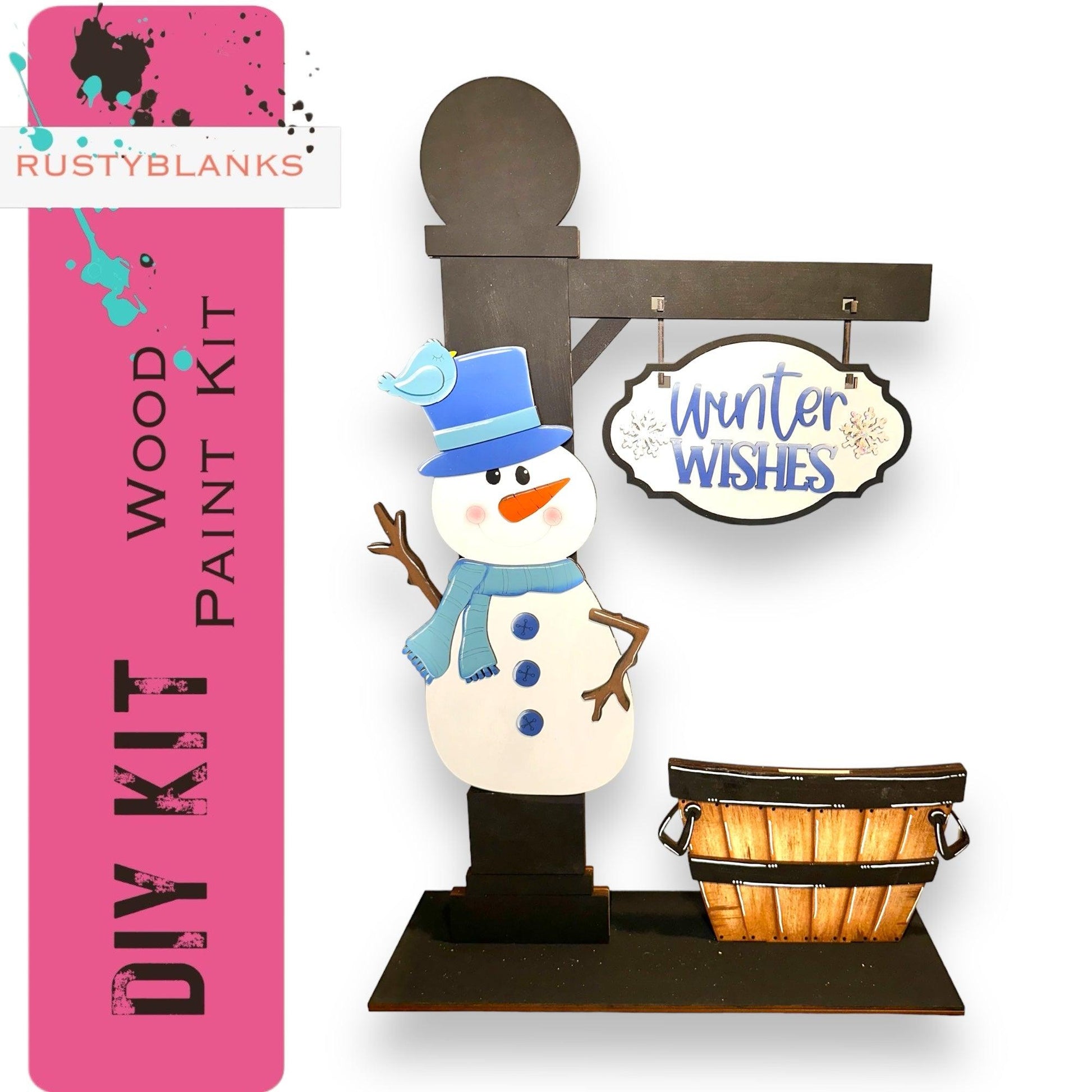 a snowman standing next to a basket and sign