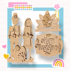 a wooden cutout of a thanksgiving scene