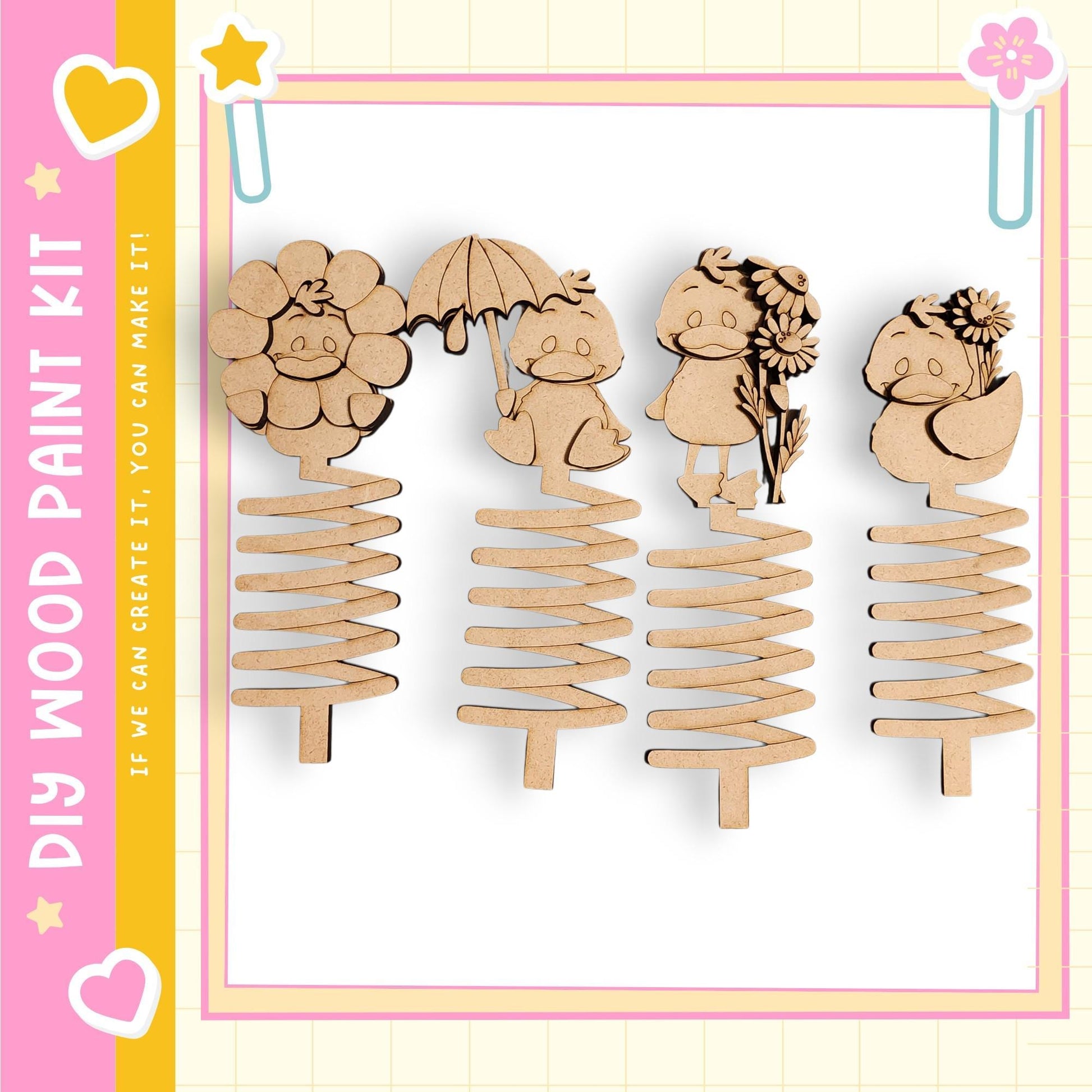 a collection of four wooden spring-like objects, each with a unique design and character on it.