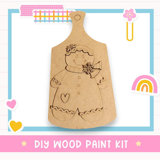 a DIY wood paint kit, including a wooden board with a drawing of a smiling person and a heart, as well as a pink and blue frame with a rainbow and a flower.