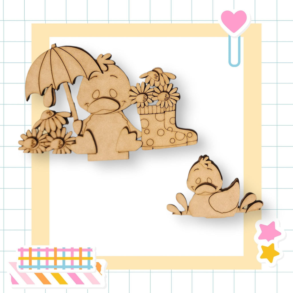 a wooden cutout of a baby elephant with a basket of flowers