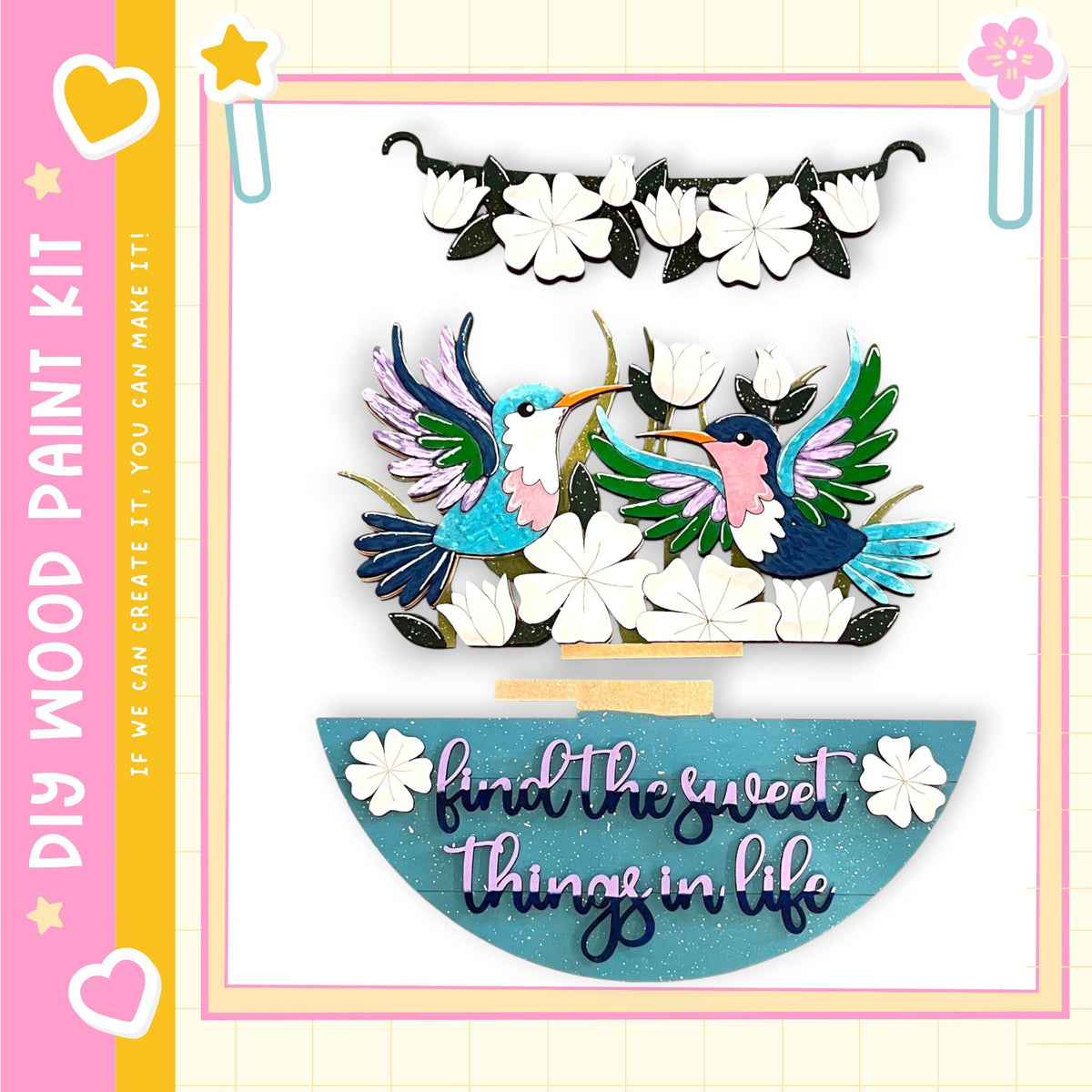 The image is a colorful and whimsical painting kit featuring a pair of birds, flowers, and a decorative frame.