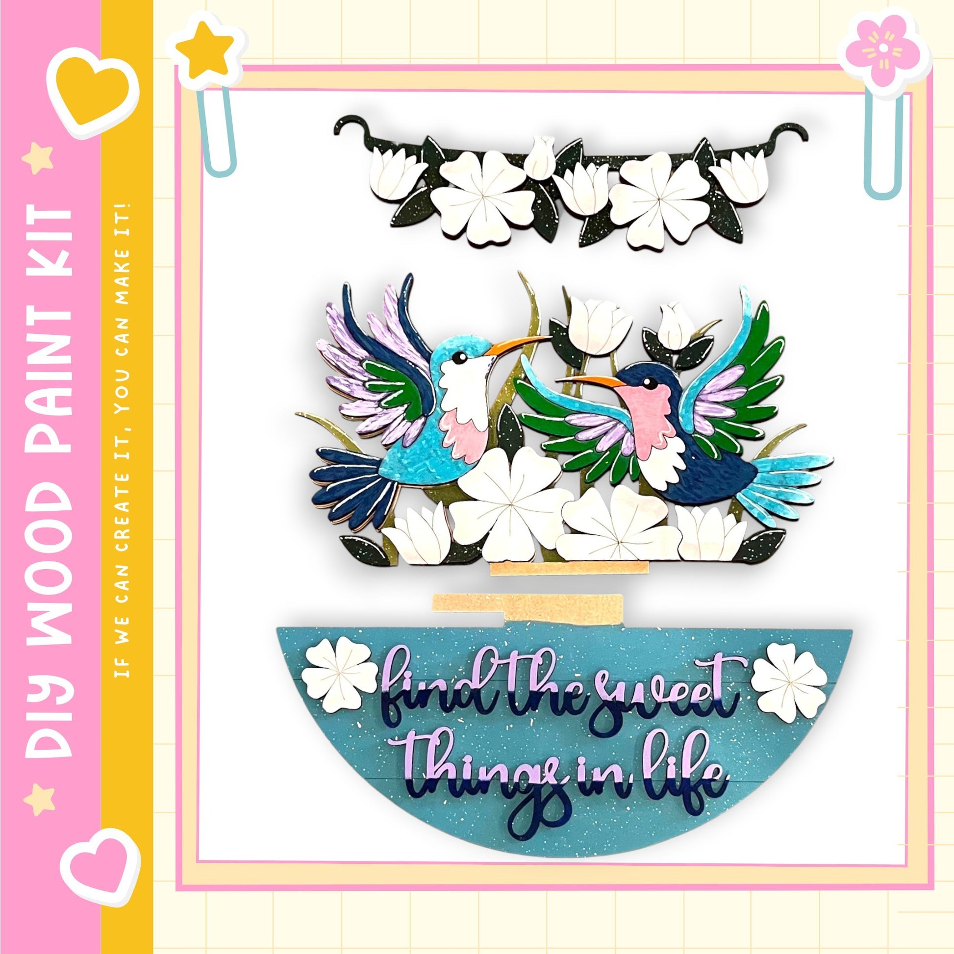 The image is a colorful and whimsical painting kit featuring a pair of birds, flowers, and a decorative frame.