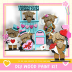 The image is a collage featuring a group of wooden toy animals, including a cow, a horse, and a dog, along with various heart-shaped and heart-studded objects. The collage is set against a pink and white background, and there is text at the bottom that reads "DIY WOOD PAINT KIT" and "IF WE CAN CREATE IT, YOU CAN MAKE."