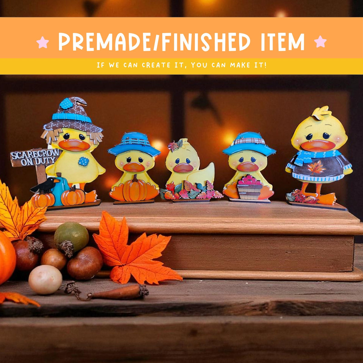 a group of five small, colorful duck figurines arranged on a wooden surface, with autumn leaves and other seasonal decorations in the background.