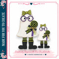 two whimsical, ghostly figures dressed in Halloween costumes, including purple glasses and green bows, holding lollipops. The caption below the image reads "Creativity Begins with One Brushstroke - Rustic Farmhouse".
