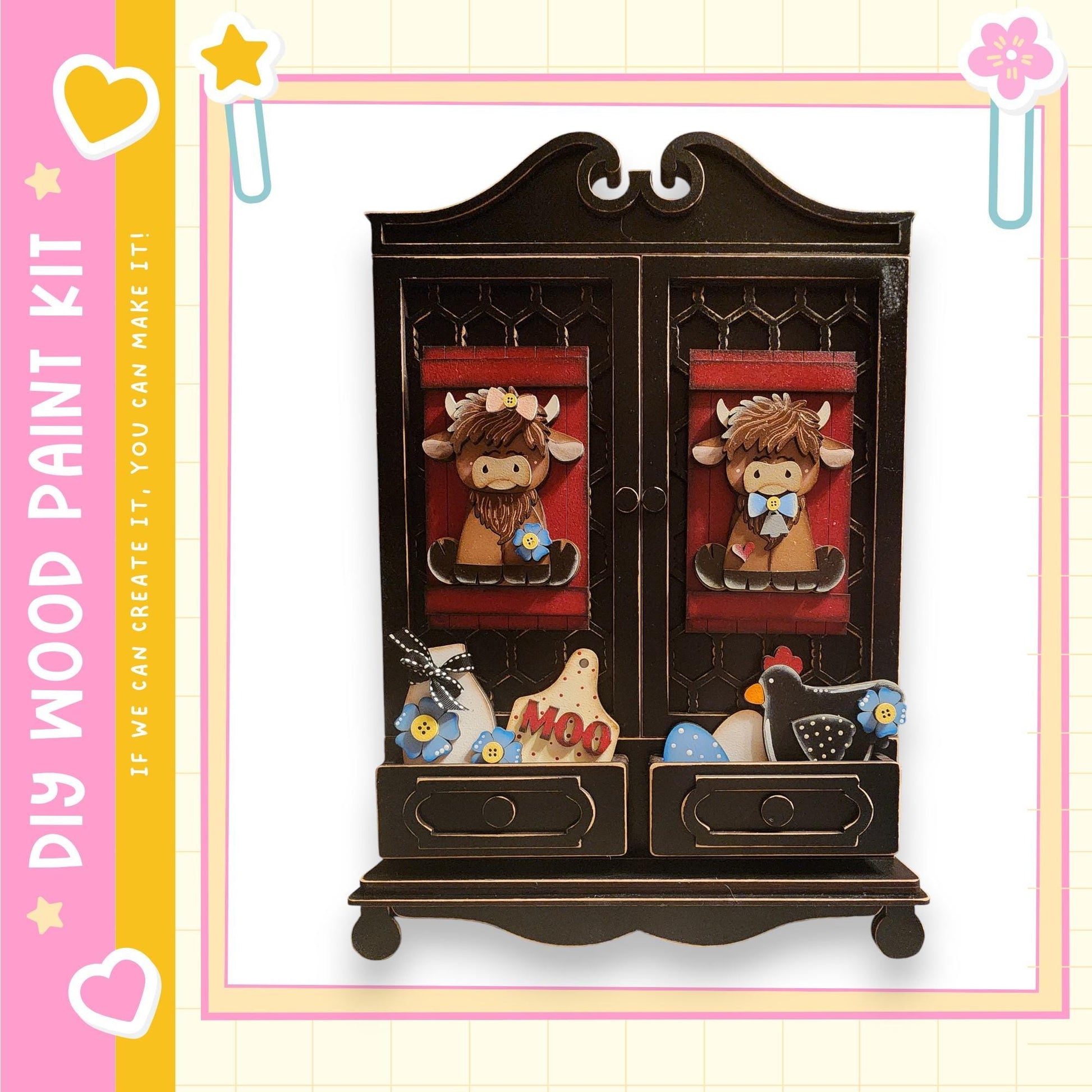 a wooden cabinet with two doors, each adorned with a painted cow character. The cabinet has two drawers below it, and there are various other small objects, such as a bird, a flower, and a star, displayed on the front. The image is described as a "DIY WOOD PAINT KIT" and includes a pink and yellow border, as well as a heart and star motif.