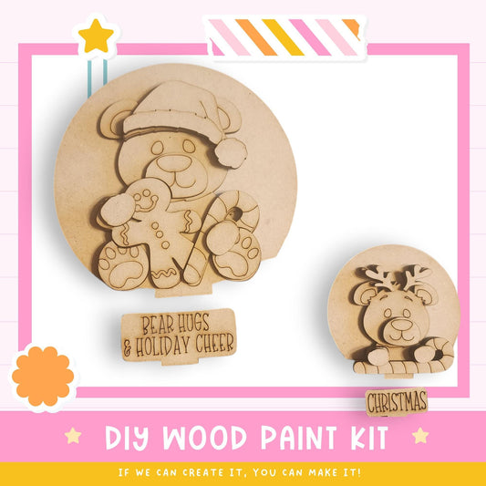 The image is a promotional image for a DIY wood paint kit, featuring two wooden bear-shaped figures and a Christmas-themed wooden figure. The kit appears to be designed for creating custom wooden decorations or gifts.