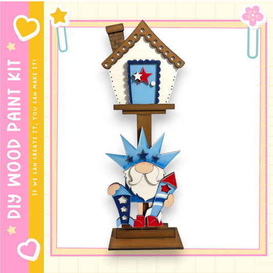 A wooden gnome figurine holding a fireworks display stands on a wooden platform, with a house-like structure above it.
