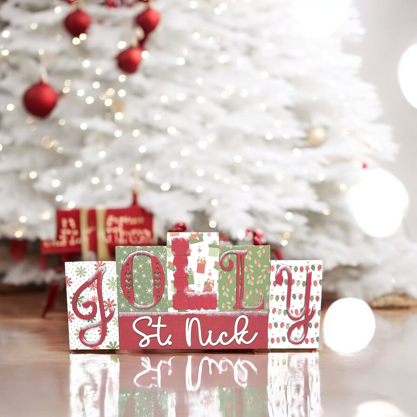 a wooden block that says jolly st nick in front of a christmas tree