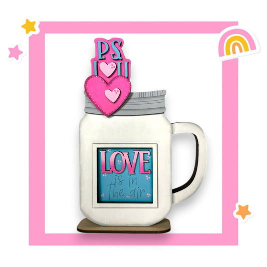 a coffee mug with a picture of a heart on top of it