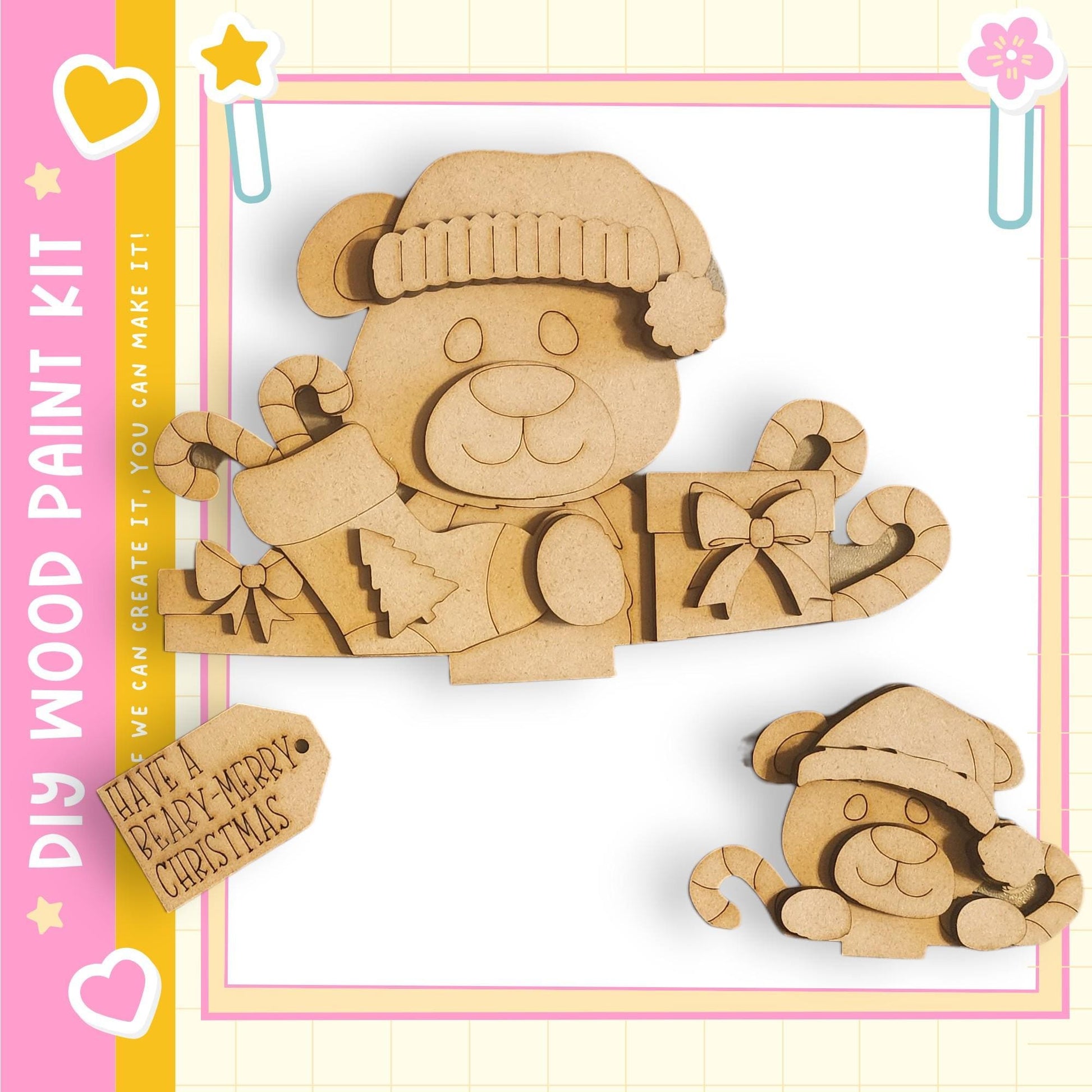 A wooden paint kit featuring a bear and a smaller bear, along with various holiday-themed elements such as candy canes and a ribbon.