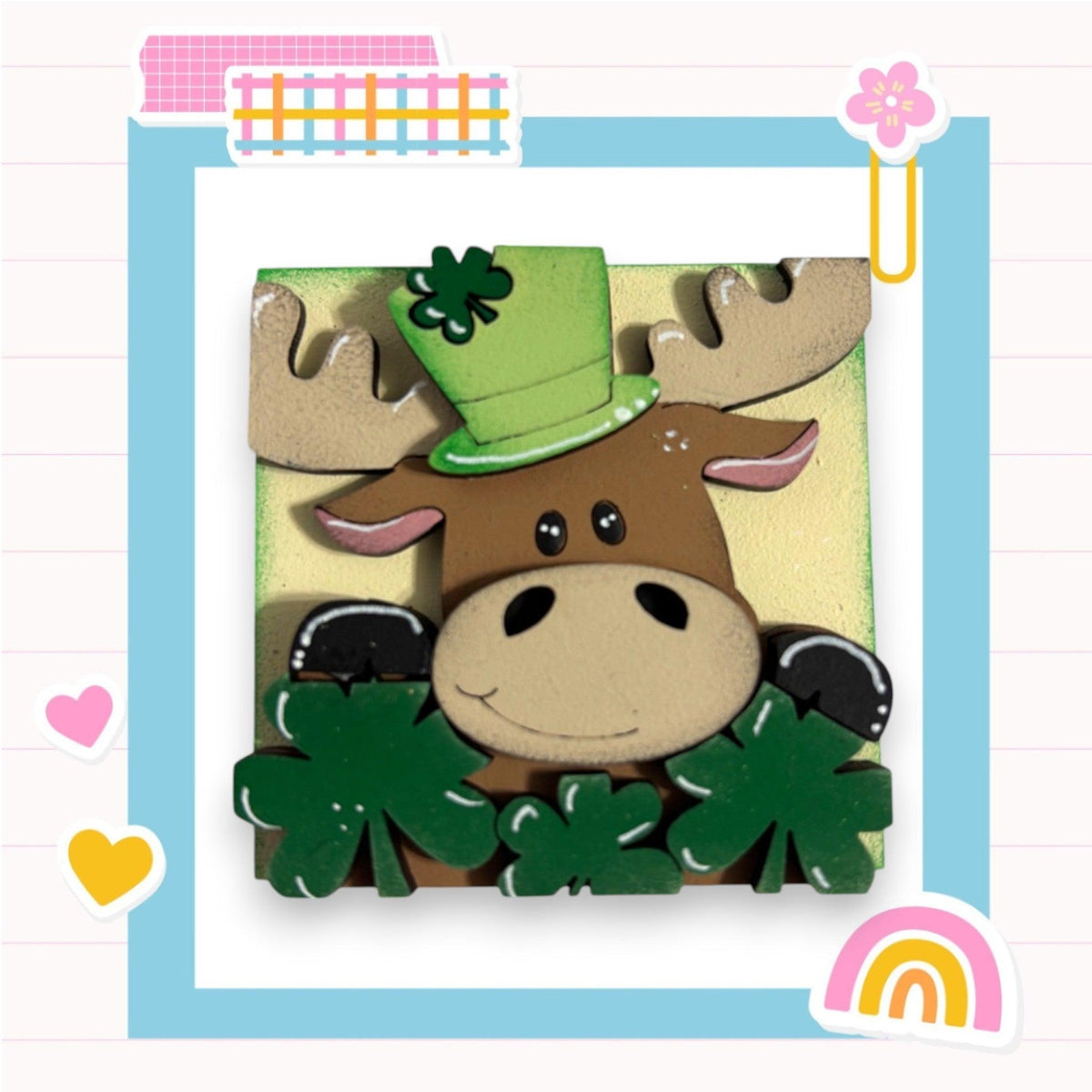 a card with a picture of a moose wearing a green hat