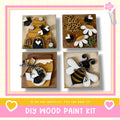 The image is a collage of four wooden paint kits, each featuring a different design related to bees and honey. The kits include a beehive, a honey jar, a bee, and a bee with a heart. The collage is framed with a pink border and the text "DIY WOOD PAINT KIT" is displayed at the bottom.