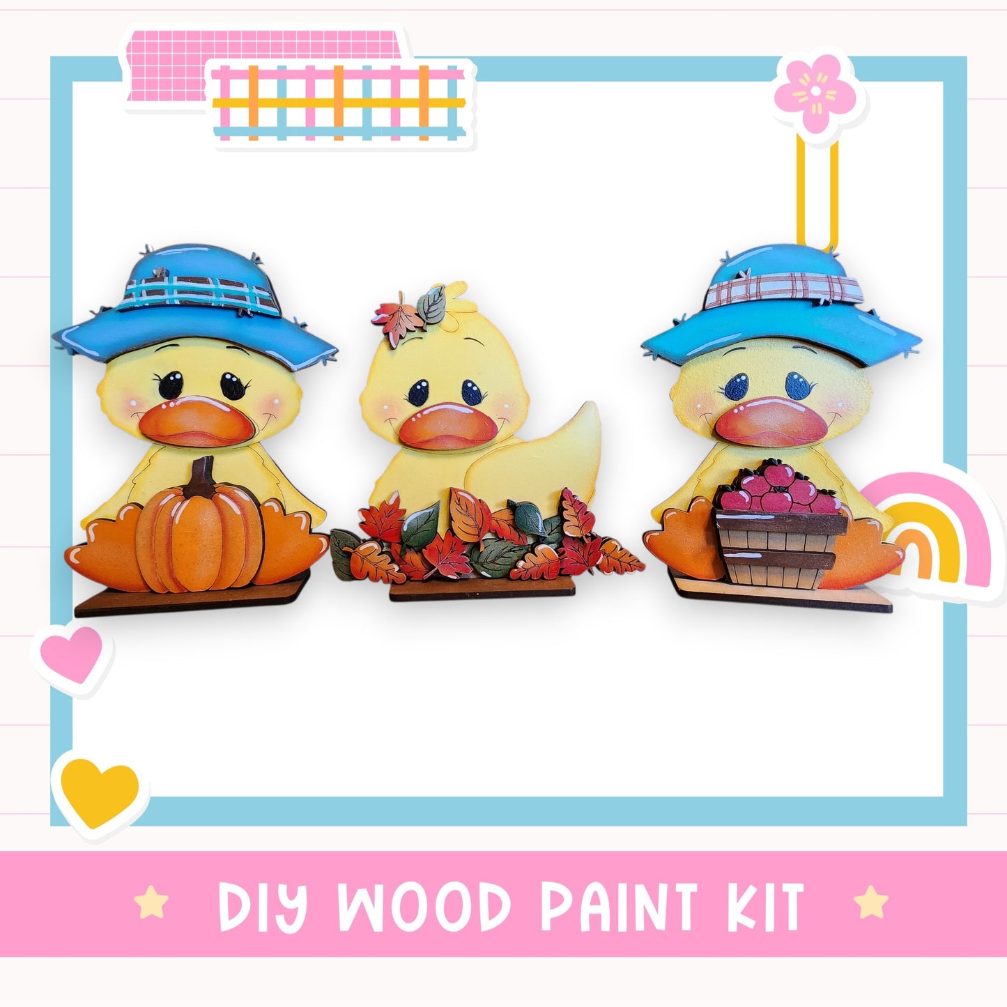 three wooden duck figurines, each wearing a hat and holding a different object, such as a pumpkin, a basket of fruit, and a flower. The image also includes a text box that reads "DIY WOOD PAINT KIT" and a heart symbol.