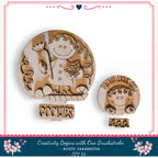two wooden cutouts of smiling faces, one larger and one smaller, both with the word "GOOZIES" written on them. The larger cutout is positioned above the smaller one, creating a visually appealing arrangement.