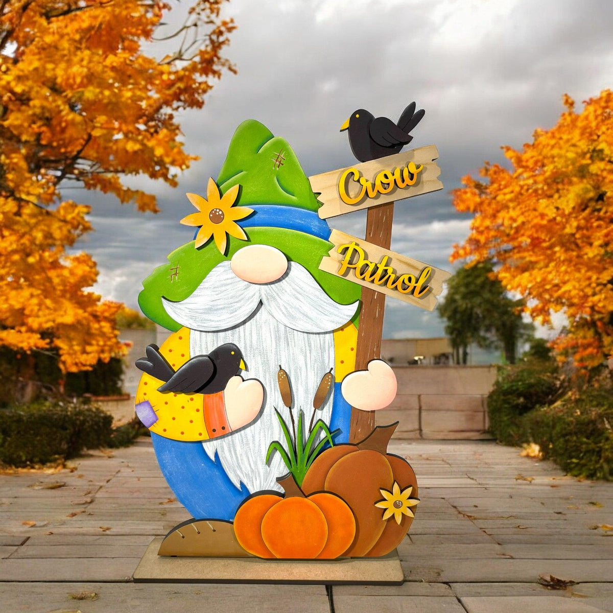 a statue of a gnome holding a sign
