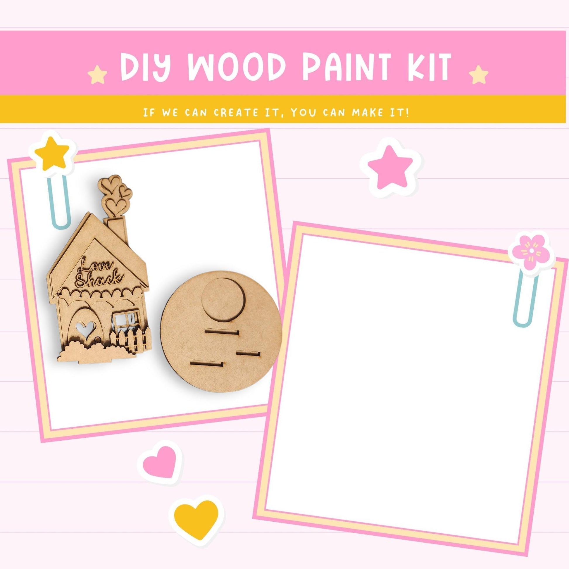 The image is a DIY wood paint kit with a house and other craft items, including a star and hearts, all set against a pink background.