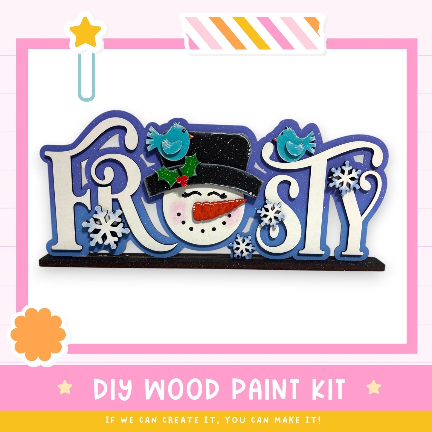 a DIY wood paint kit for creating a snowman, with various decorative elements such as a snowman, snowflakes, and a star.