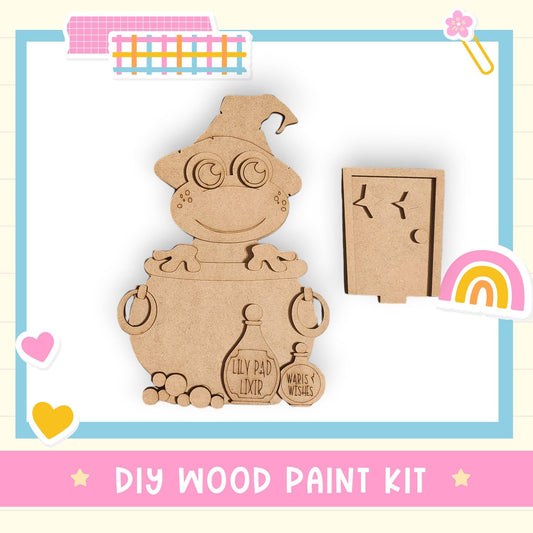 a DIY wood paint kit, including a wooden witch's cauldron and a wooden star. The kit appears to be a creative and fun project for children or adults to engage in a woodworking activity.