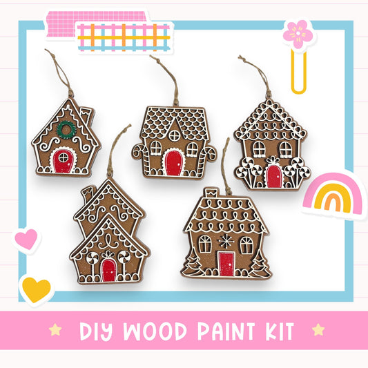 a DIY wood paint kit for creating wooden ornaments in the shape of houses, with various designs and decorations.