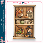 The image is a wooden decoration with a Thanksgiving theme, featuring a turkey, pumpkins, a boy in a hat, and a sign that says "Give Thanks".